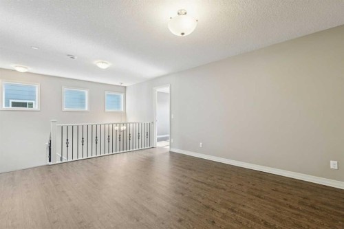 33 Sundown Grove, Cochrane, AB - Indoor Photo Showing Other Room