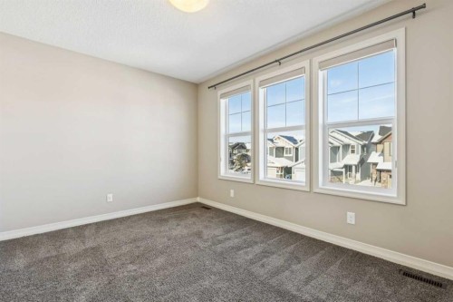 33 Sundown Grove, Cochrane, AB - Indoor Photo Showing Other Room