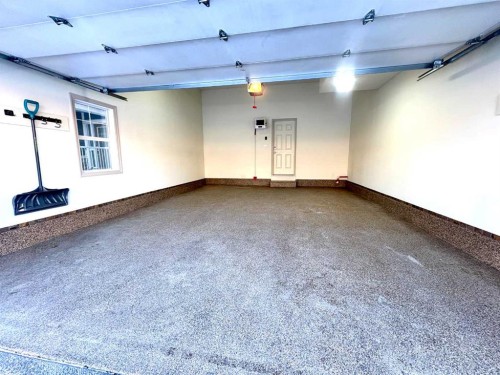 33 Sundown Grove, Cochrane, AB - Indoor Photo Showing Garage