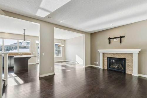 33 Sundown Grove, Cochrane, AB - Indoor Photo Showing Living Room With Fireplace