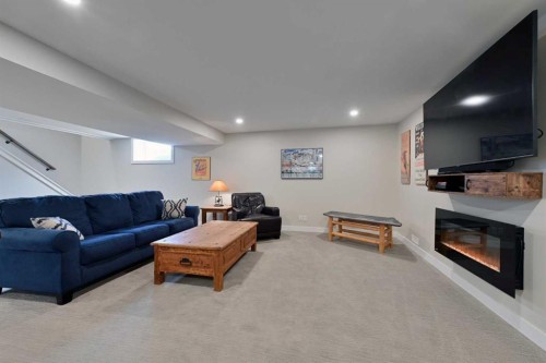 6427 Lombardy Crescent Sw, Calgary, AB - Indoor Photo Showing Basement With Fireplace