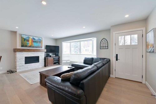 6427 Lombardy Crescent Sw, Calgary, AB - Indoor Photo Showing Living Room With Fireplace