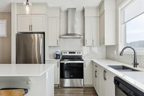 129 Dawson Drive, Chestermere, AB - Indoor Photo Showing Kitchen With Stainless Steel Kitchen With Double Sink With Upgraded Kitchen
