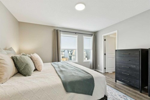 129 Dawson Drive, Chestermere, AB - Indoor Photo Showing Bedroom
