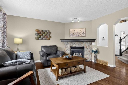 327 Chaparral Drive Se, Calgary, AB - Indoor Photo Showing Living Room With Fireplace