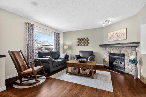 327 Chaparral Drive Se, Calgary, AB - Indoor Photo Showing Living Room With Fireplace