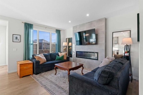 35 Cranbrook Mount Se, Calgary, AB - Indoor Photo Showing Living Room With Fireplace