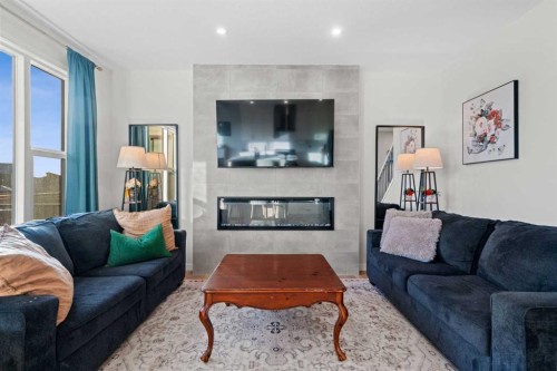 35 Cranbrook Mount Se, Calgary, AB - Indoor Photo Showing Living Room With Fireplace