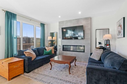 35 Cranbrook Mount Se, Calgary, AB - Indoor Photo Showing Living Room With Fireplace