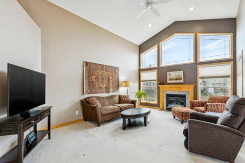 232 Springmere Place, Chestermere, AB - Indoor Photo Showing Living Room With Fireplace