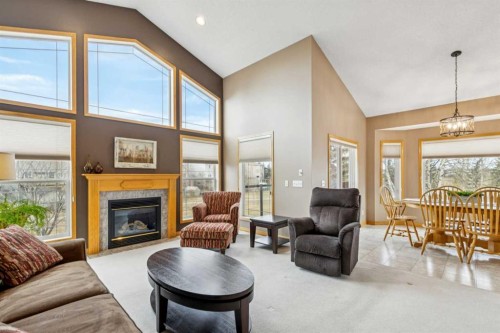 232 Springmere Place, Chestermere, AB - Indoor Photo Showing Living Room With Fireplace
