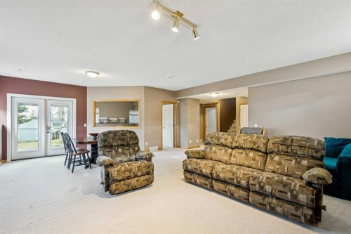 232 Springmere Place, Chestermere, AB - Indoor Photo Showing Living Room
