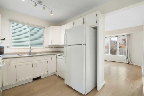 25 Mckernan Road Se, Calgary, AB - Indoor Photo Showing Kitchen With Double Sink