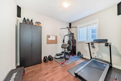 57 Silverado Skies Way Sw, Calgary, AB - Indoor Photo Showing Gym Room