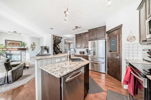 57 Silverado Skies Way Sw, Calgary, AB - Indoor Photo Showing Kitchen With Stainless Steel Kitchen With Double Sink With Upgraded Kitchen