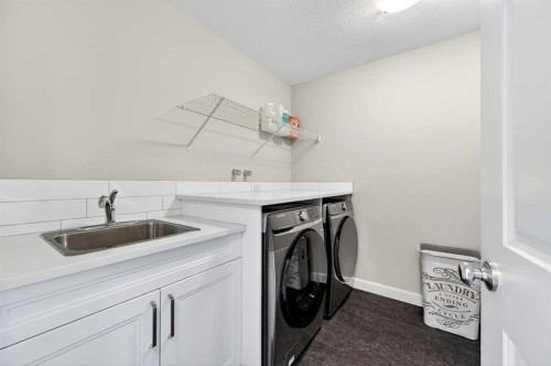 77 Belvedere Drive Se, Calgary, AB - Indoor Photo Showing Laundry Room