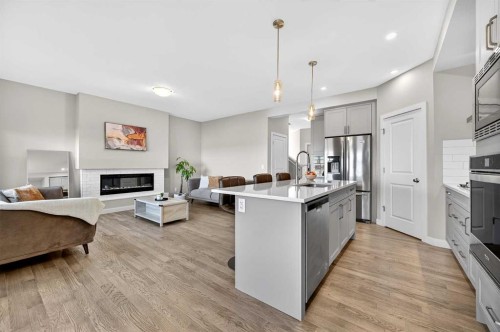 77 Belvedere Drive Se, Calgary, AB - Indoor Photo Showing Kitchen With Fireplace With Upgraded Kitchen