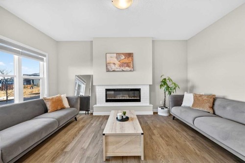 77 Belvedere Drive Se, Calgary, AB - Indoor Photo Showing Living Room With Fireplace