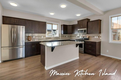 207 River Heights Crescent, Cochrane, AB - Indoor Photo Showing Kitchen With Upgraded Kitchen