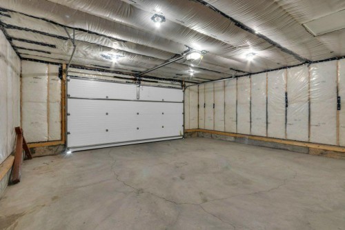 207 River Heights Crescent, Cochrane, AB - Indoor Photo Showing Garage