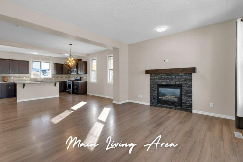 207 River Heights Crescent, Cochrane, AB - Indoor Photo Showing Living Room With Fireplace