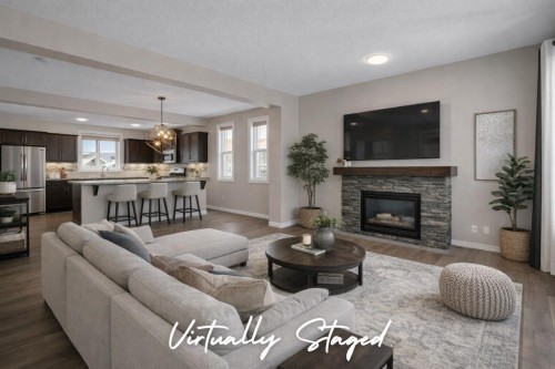 207 River Heights Crescent, Cochrane, AB - Indoor Photo Showing Living Room With Fireplace