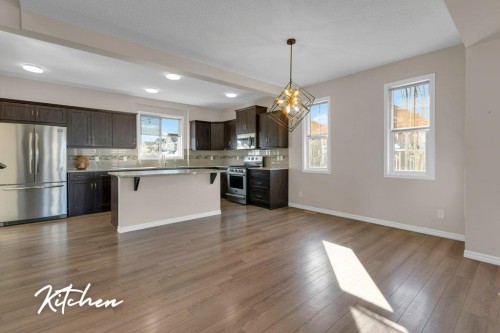 207 River Heights Crescent, Cochrane, AB - Indoor Photo Showing Kitchen With Upgraded Kitchen