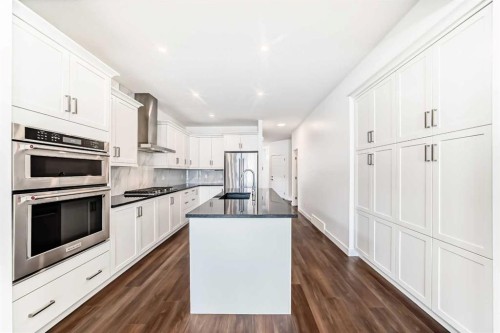 63 Riviera Court, Cochrane, AB - Indoor Photo Showing Kitchen With Upgraded Kitchen