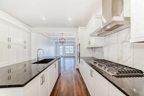 63 Riviera Court, Cochrane, AB - Indoor Photo Showing Kitchen With Upgraded Kitchen