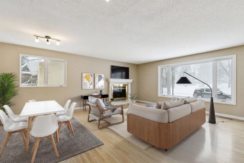 389 Capri Avenue Nw, Calgary, AB - Indoor Photo Showing Living Room With Fireplace