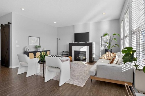 126 Bayview Circle Sw, Airdrie, AB - Indoor Photo Showing Living Room With Fireplace