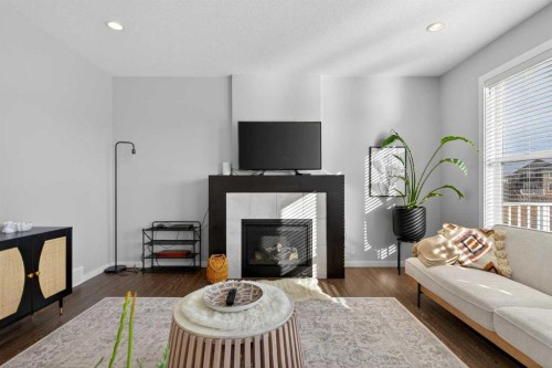 126 Bayview Circle Sw, Airdrie, AB - Indoor Photo Showing Living Room With Fireplace