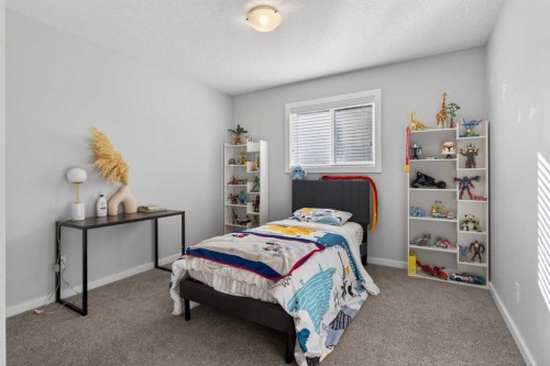 126 Bayview Circle Sw, Airdrie, AB - Indoor Photo Showing Bedroom