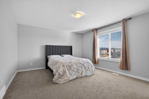 126 Bayview Circle Sw, Airdrie, AB - Indoor Photo Showing Bedroom