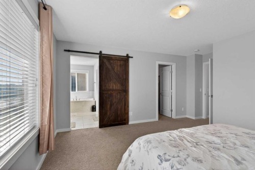 126 Bayview Circle Sw, Airdrie, AB - Indoor Photo Showing Bedroom