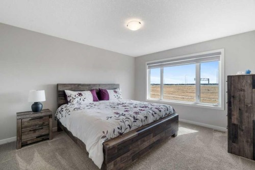 234 Carringsby Way Nw, Calgary, AB - Indoor Photo Showing Bedroom