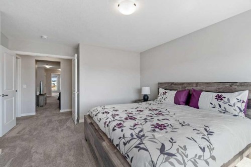 234 Carringsby Way Nw, Calgary, AB - Indoor Photo Showing Bedroom