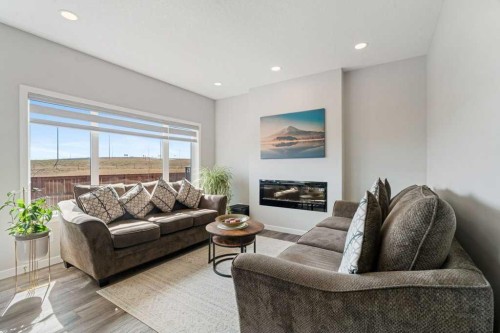 234 Carringsby Way Nw, Calgary, AB - Indoor Photo Showing Living Room With Fireplace