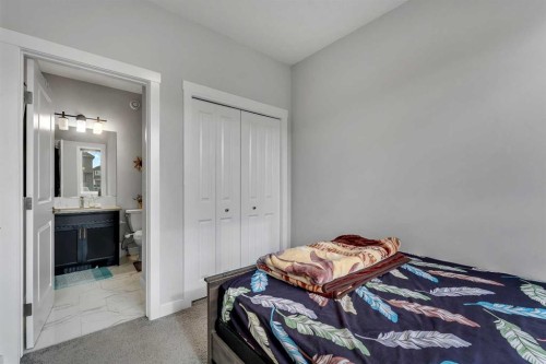 521 Chinook Winds Gardens Sw, Airdrie, AB - Indoor Photo Showing Bedroom