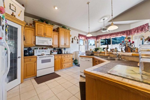 16 Arbour Estates View Nw, Calgary, AB - Indoor Photo Showing Kitchen With Double Sink