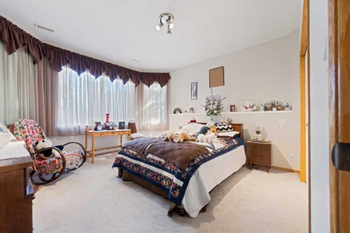 16 Arbour Estates View Nw, Calgary, AB - Indoor Photo Showing Bedroom