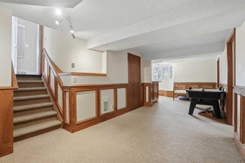 311 Coach Light Bay Sw, Calgary, AB - Indoor Photo Showing Other Room