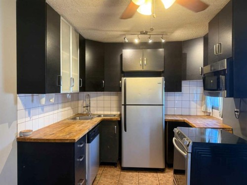 5E-515 17 Avenue Sw, Calgary, AB - Indoor Photo Showing Kitchen With Stainless Steel Kitchen With Double Sink