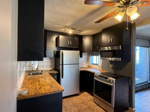 5E-515 17 Avenue Sw, Calgary, AB - Indoor Photo Showing Kitchen With Stainless Steel Kitchen With Double Sink