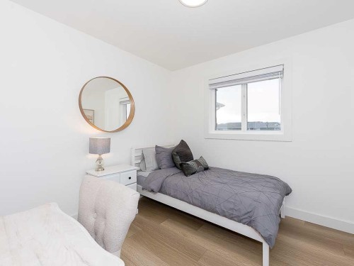 613 Lambeau Link Se, Airdrie, AB - Indoor Photo Showing Bedroom