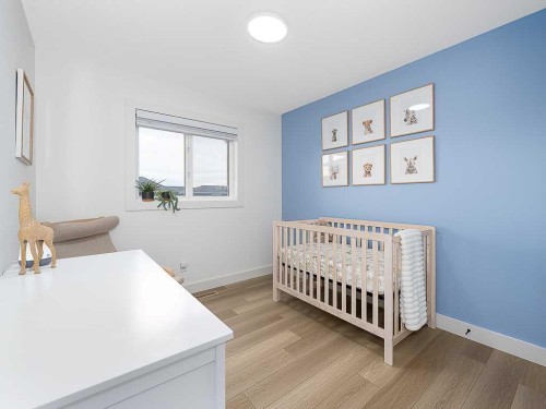 613 Lambeau Link Se, Airdrie, AB - Indoor Photo Showing Bedroom