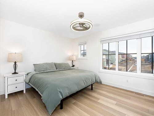 613 Lambeau Link Se, Airdrie, AB - Indoor Photo Showing Bedroom