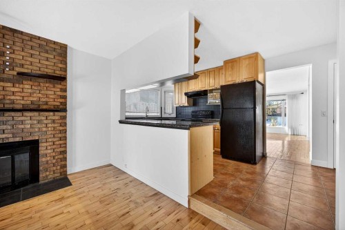 128 Bermuda Drive Nw, Calgary, AB - Indoor With Fireplace