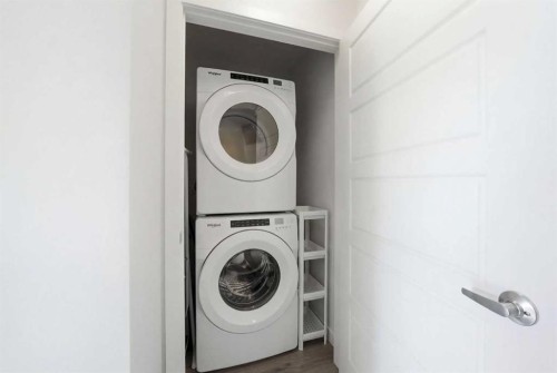 66 Evanscrest Manor Nw, Calgary, AB - Indoor Photo Showing Laundry Room