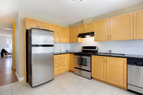 120 Cedarwood Lane Sw, Calgary, AB - Indoor Photo Showing Kitchen With Stainless Steel Kitchen